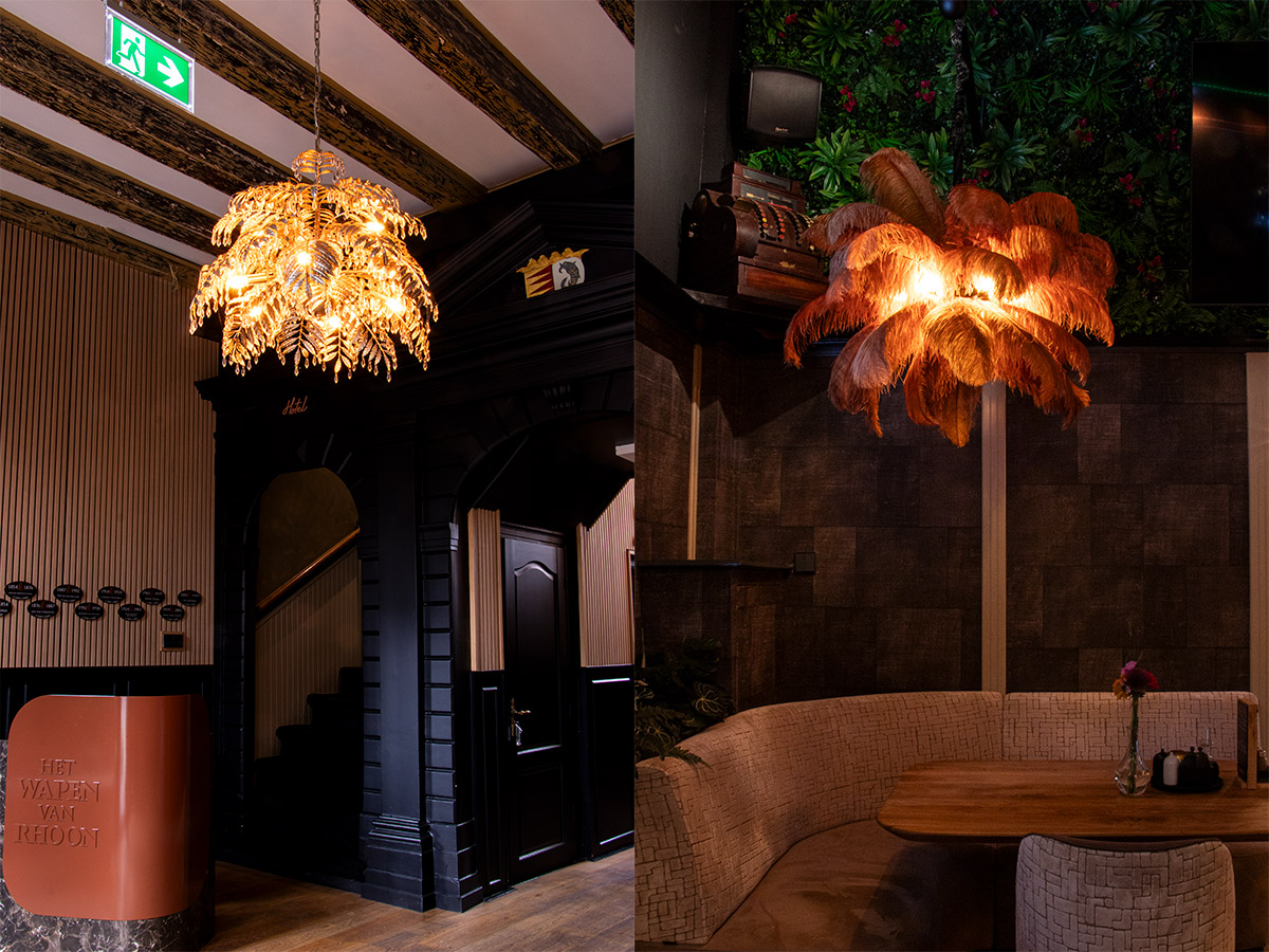 Twee opvallende hanglampen van Straluma in Het Wapen van Rhoon: een gouden bladlamp in de entree en een warme veerlamp boven een zithoek.